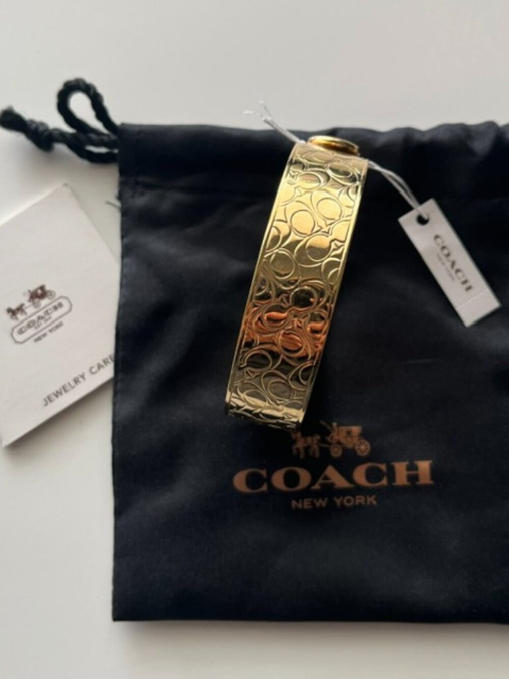 COACH Gold Bangle Bracelet, Signature C Embossed - Picture 2 of 5